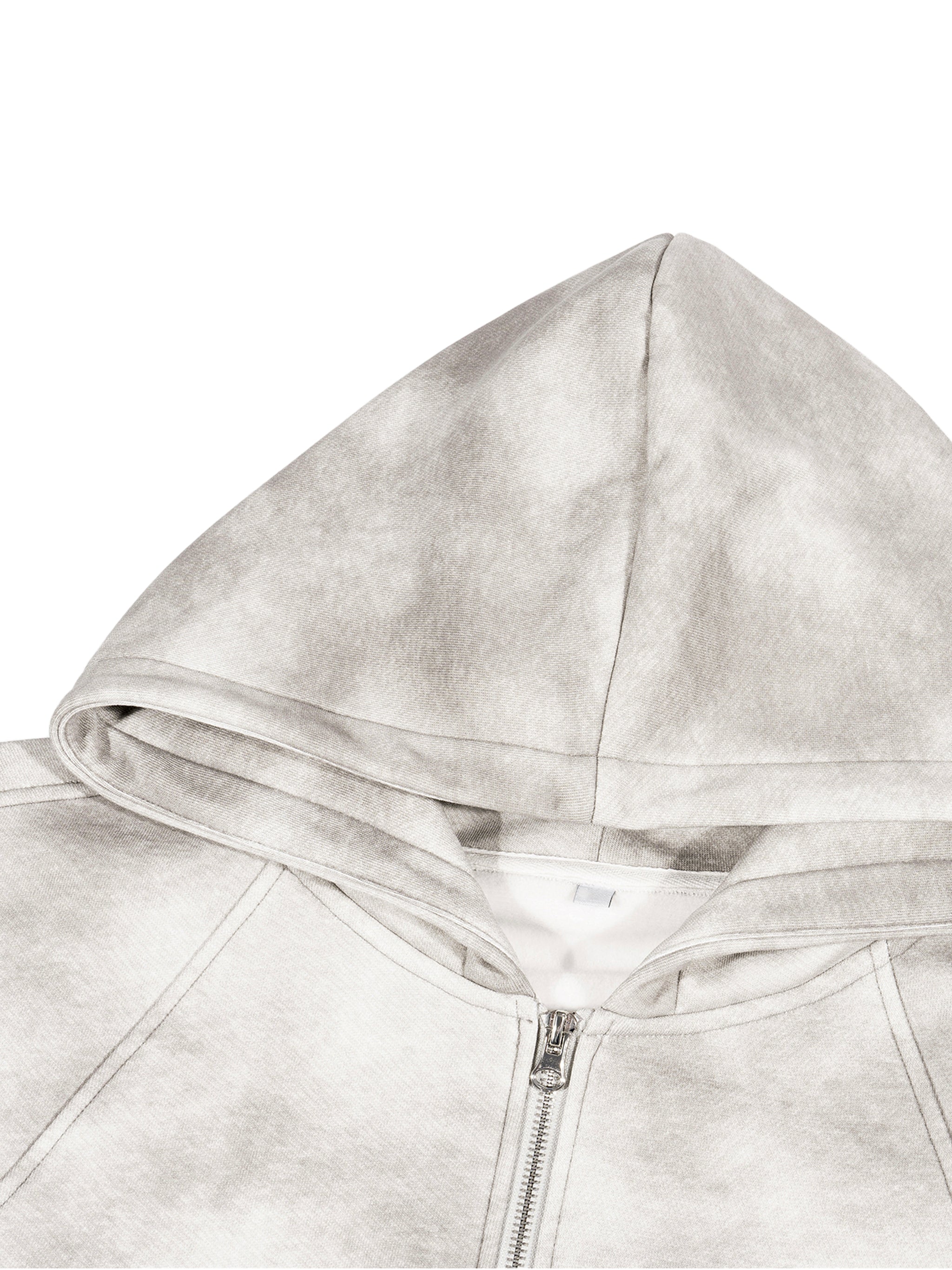 Close-up of a gray hoodie with a zipper on a white background