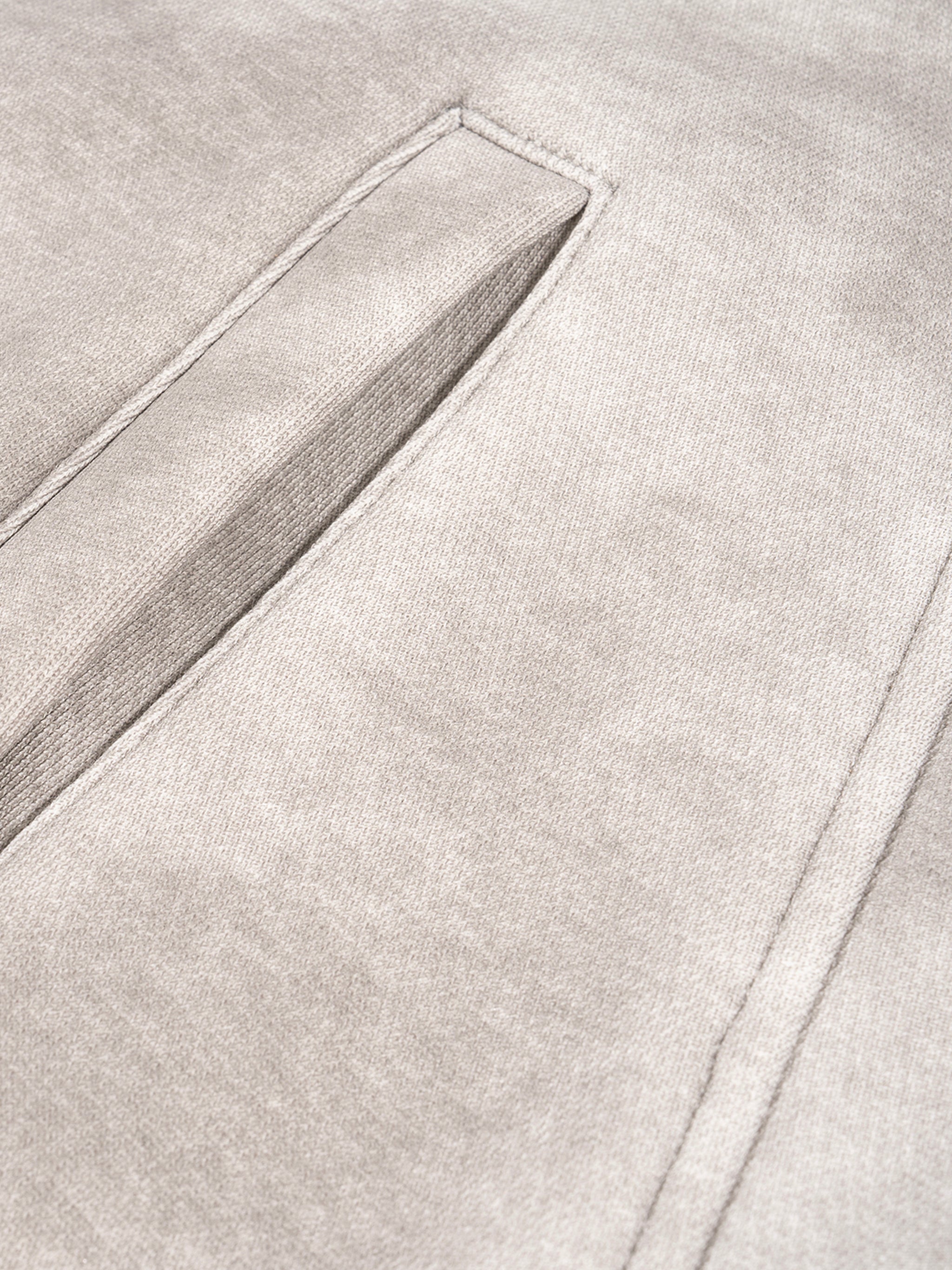 Close-up of a textured gray fabric with a subtle pattern