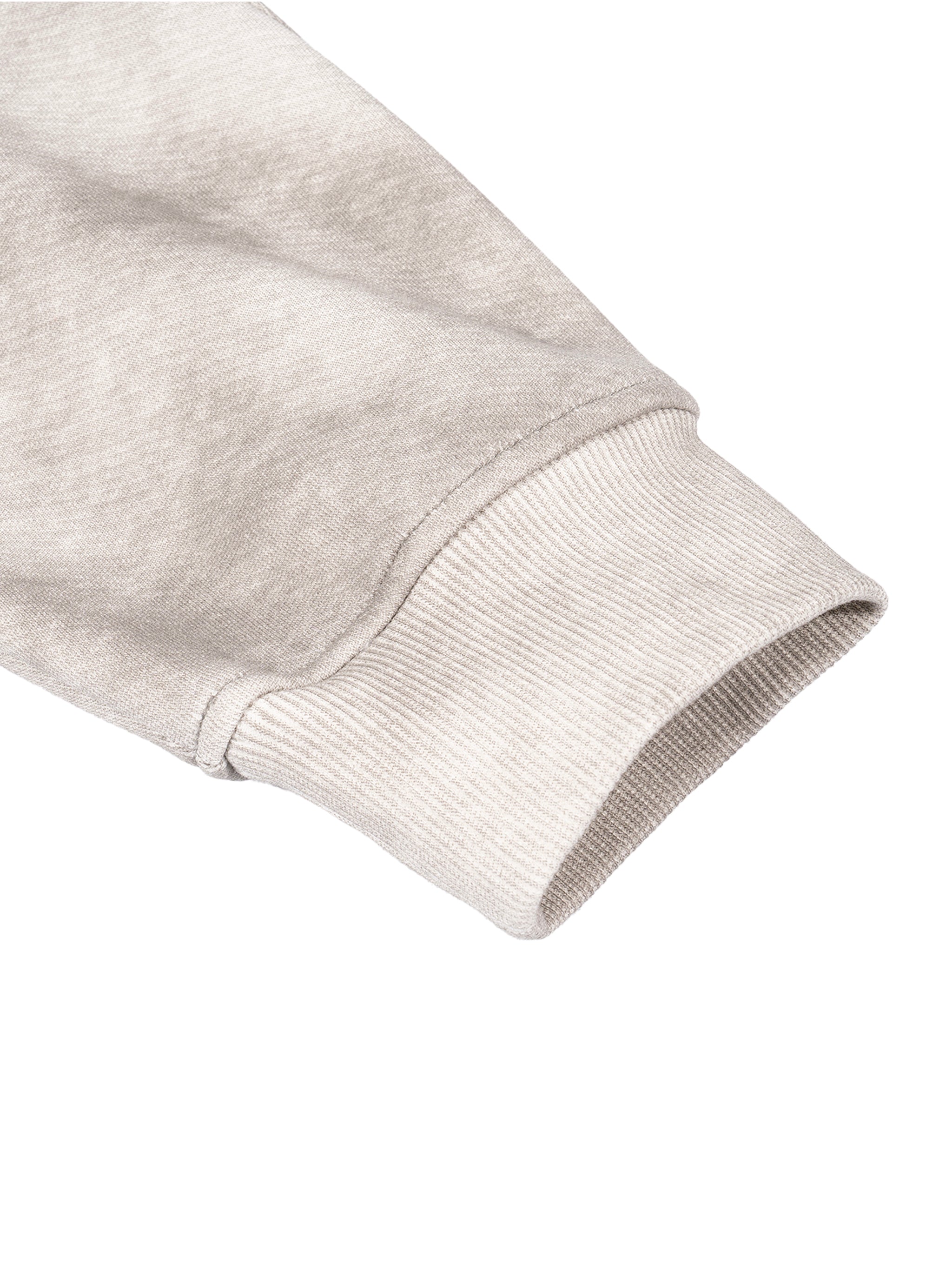Close-up of a light gray sweatshirt sleeve on a white background